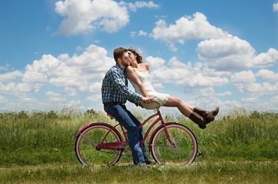 a couple on a bike in a happy relationship