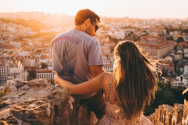 How to Get to Know Someone in a Long-Distance Relationship 3 couple together on the hill overlooking the city during a visit while in a long-distance relationship.jpg